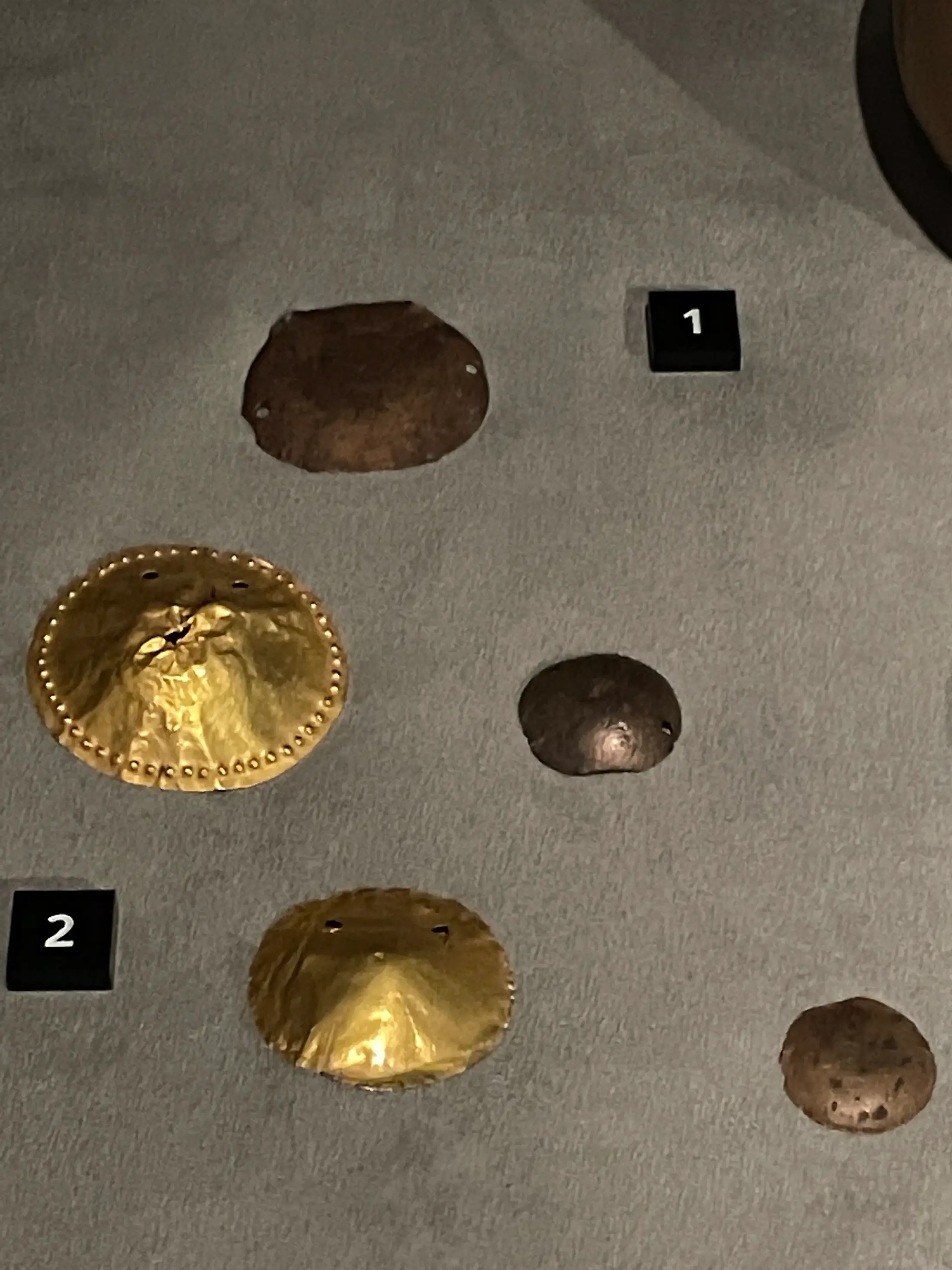 Round gold and copper appliqués