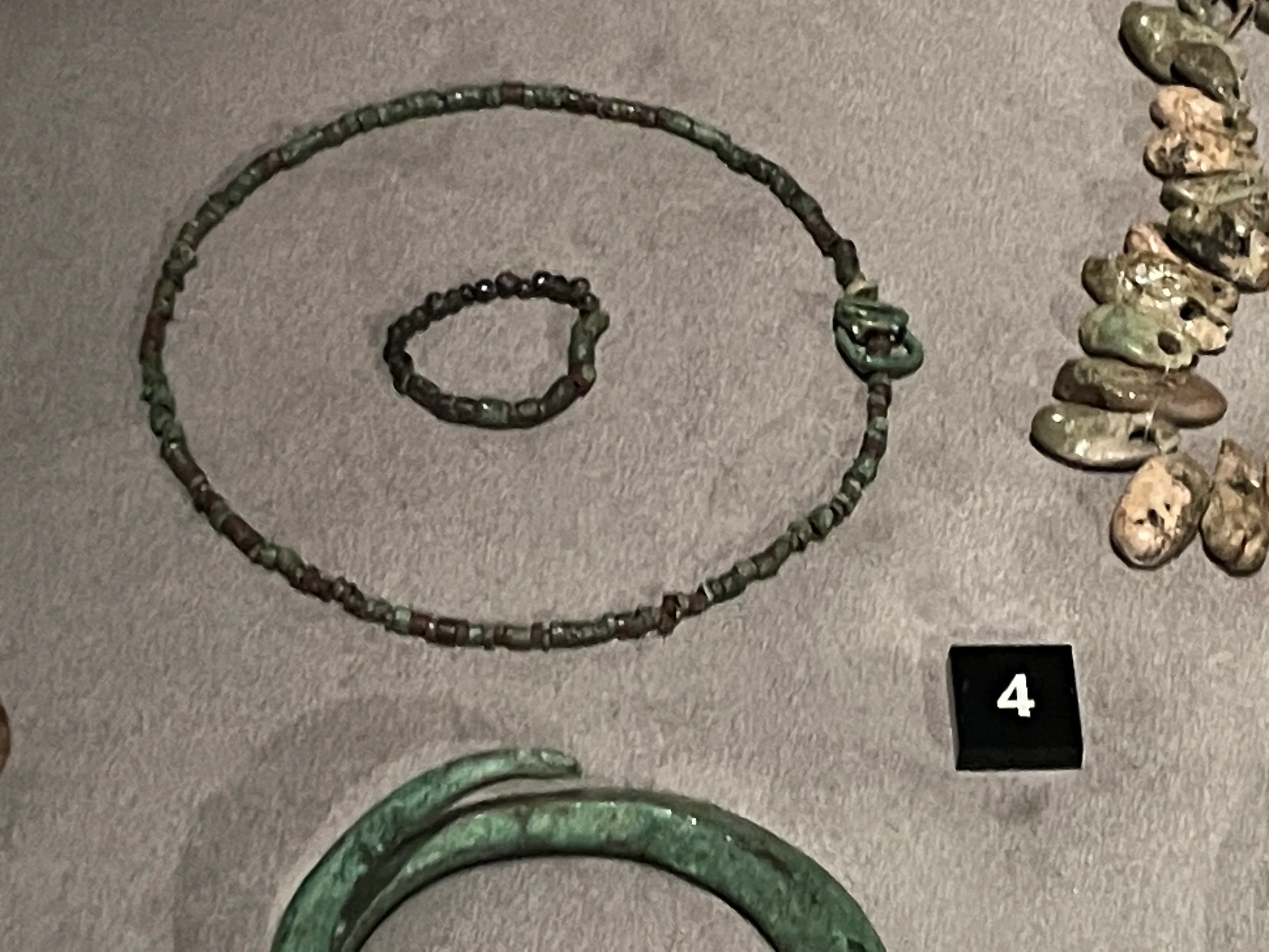 Copper necklaces in a display case