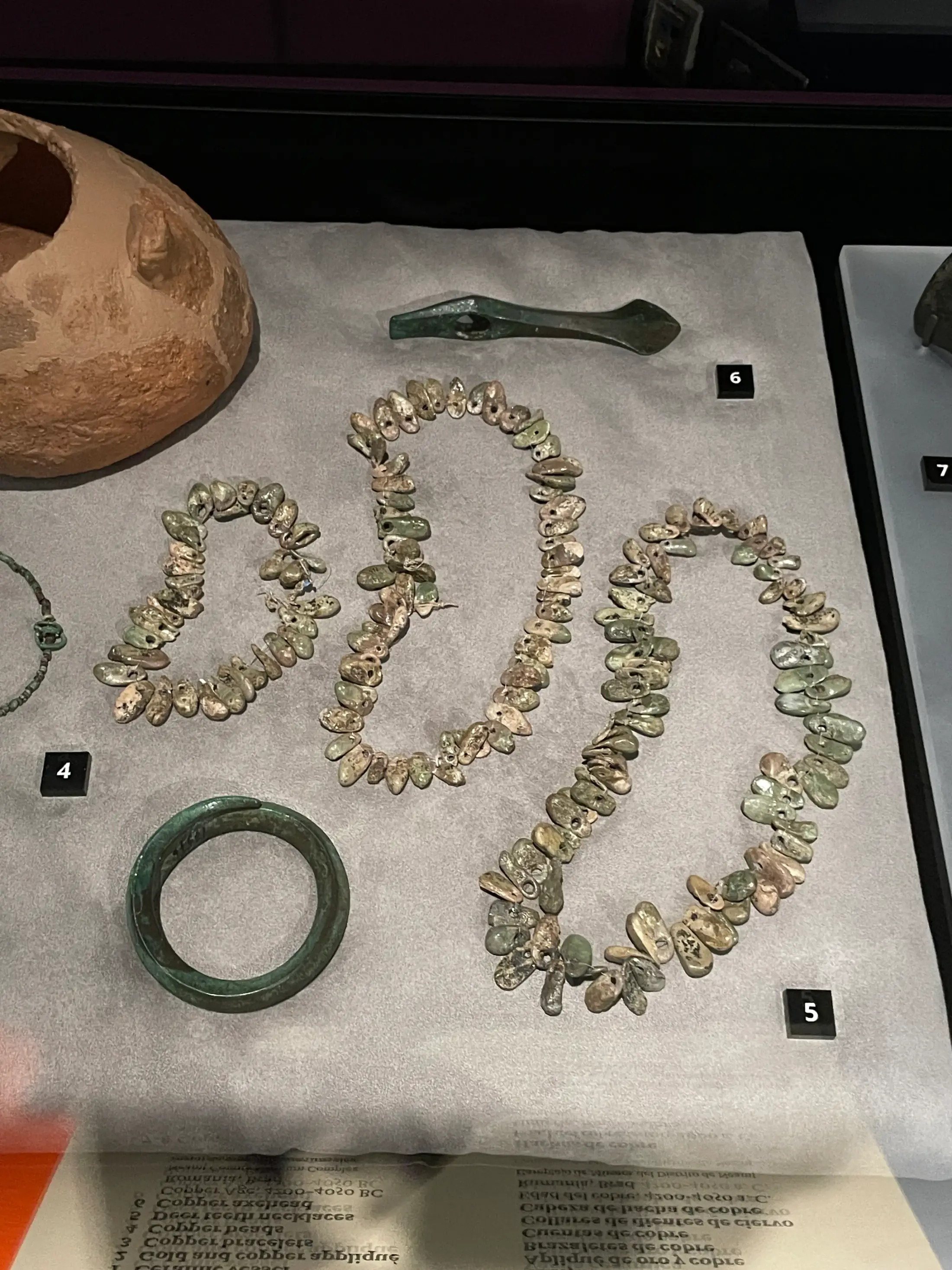 Deer-tooth necklaces and a copper axehead