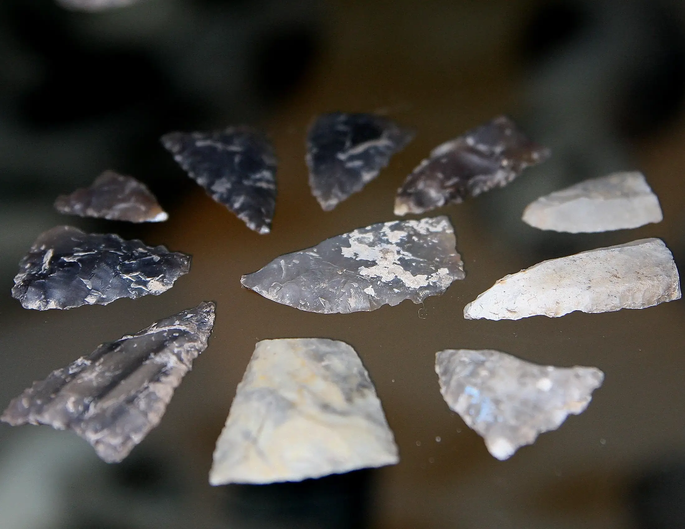 Flint points on a dark ground
